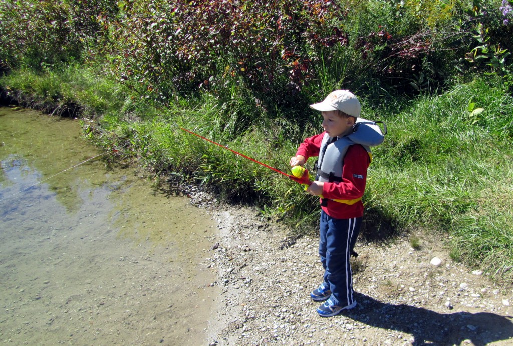 My four-year-old son reeling in a sunfish